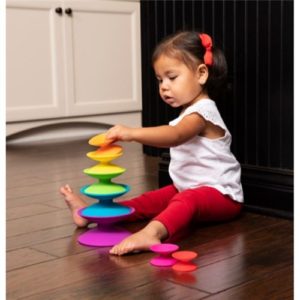 Fat brain Spoolz. At first glance, it's a stacking toy. But look a little closer - feel, explore, and experiment a little further - and quickly you'll discover... This is truly art at play!